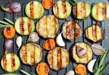 Background of vegetarian grilled vegetables on a grill top view