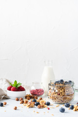 Healthy breakfast set on grey background. The concept of delicious and healthy food. Top view, copy space.