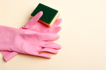 Pink rubber gloves and sponge, cleaning servise banner copy space text.