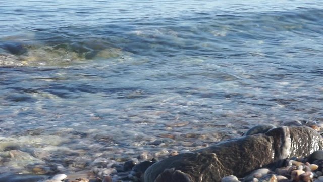 relaxing waves edge beach on spring sunset