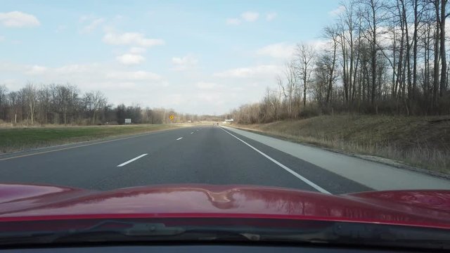 Driving Down Country Highway on Clear Blue Sunny Sky Day