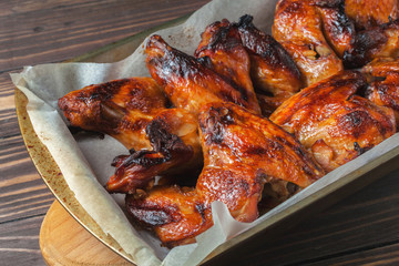 Baked chicken wings on a baking sheet, with a golden crispy crust