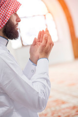 Religious arab muslim man reading holy quran