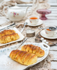Vanilla cream buns with cinnamon sugar topping - bakery with antiques, vitnage style table