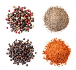 Heap of peppercorns and ground pepper on a white background, isolated. The view from top