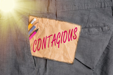 Handwriting text writing Contagious. Conceptual photo transmissible by direct or indirect contact...