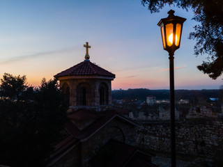 Saint Petka church (Crkva Svete Petke) in Kalemegdan fortress or Belgrade fortress on the hill above confluence rivers Sava and Danube at sunset.