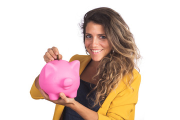 Woman holding a piggy bank on studio.