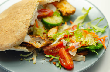 Mediterranean style pitta prepared with spicy chicken, cucumber, tomato, salad and mayo sauce