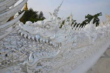 A huge dragon welcomes visitors at Wat Rong Khun, the beautiful white temple in Chiang Rai