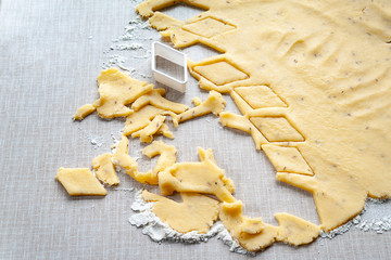 Cutting dough cookies. Forming baking dough with a cookie cutter. Selective soft focus.