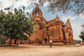 Woman walks around a temple in Bagan, Myanmar