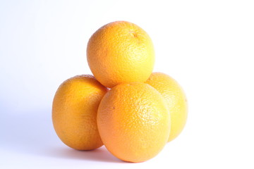 close up of bunch of four orange fruits, white background