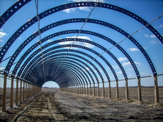 Steel structure for hoop barn during construction before tarp installation