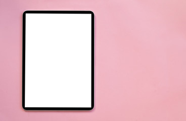 Modern tablet on a pink background.