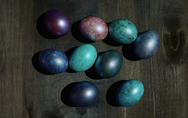 eggs in the center on a dark wooden background top view