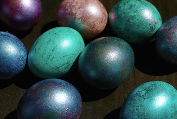 eggs in the center on a dark wooden background, top view, close-up