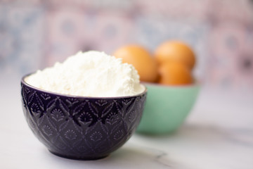 Kitchen utensils for cooking, eggs and flour in bowl
