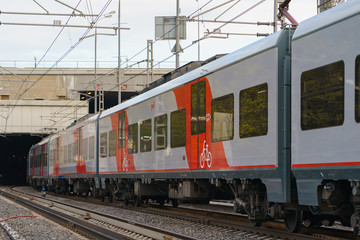 Detail of the carriage of the contemporary passenger's train Lastochka of Moscow Central Circle / MCC designated Line 14 / Encircle Line in spring day. Comfort lifestyle of city. Industrial Mosque.