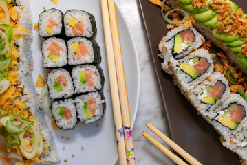 sushi on plates withe and brown