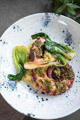 Grilled Octopus with Sauteed Greens and Herb Sauce