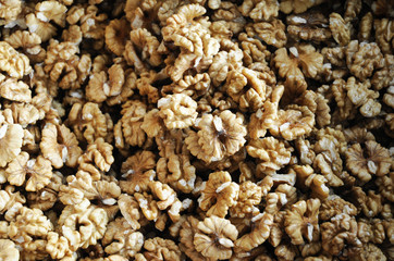 top view of peeled walnut as food background