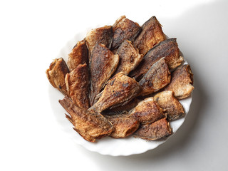 fried fish on a white plate