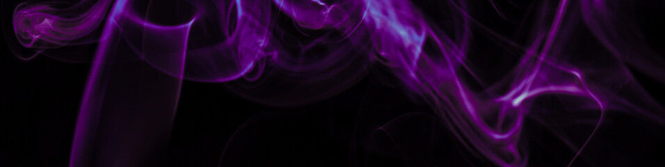 Purple smoke on black background