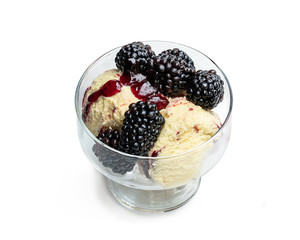 Soft ice cream with fresh blackberries isolated on white