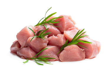 Raw chicken breast fillet chunks with tarragon herb isolated on white