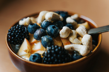 bowl of berries, nuts and yogurt