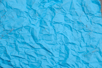 Crumpled paper of blue color, abstract background, concept.