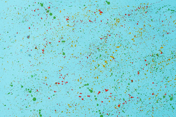 Drops of watercolor on a blue background.