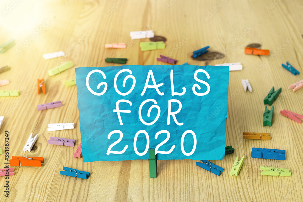 Poster writing note showing goals for 2020. business concept for object of an individuals ambition or effor