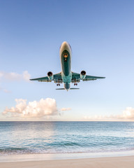 Fototapeta na wymiar Boeing B767 flying into paradise
