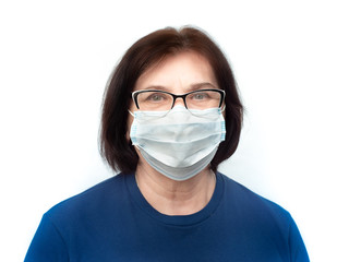 Elderly woman in a medical mask on white background