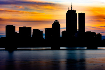 Fototapeta na wymiar Boston sunset skyline from Cambridge Parkway in Boston, Massachusetts USA.