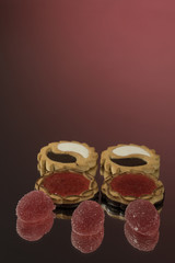 Several marmalade sweets isolated on a red background