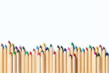 Color pencils on a light gray background. Frame of pencils. Flat lay. Copy space.