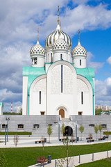 Fototapeta na wymiar Construction of Moscow river embankment and St. Nicholas Church in new area of Pavshinsky floodplain