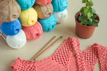 balls of yarn and crochet hooks