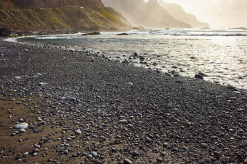 Beniho (Benijo Beach) - beautiful black volcanic sand beach on the sunset with great view of the cliffs . North part of Tenerife. Canary Islands. Spain