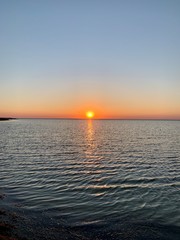 sunset over the ocean beach travel sky nature autumn spring beautiful summer sea sun water waves