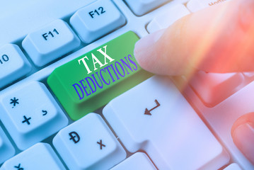 Word writing text Tax Deductions. Business photo showcasing an amount or cost that subtracted from...