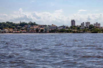 Fototapeta premium Buildings in Guaiba city and Guaiba lake
