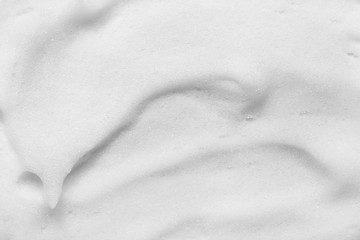 Foam texture background. Soap, shampoo, mousse, shower gel bubbles. Thick foam splash. Hygiene...