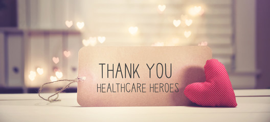 Thank You Healthcare Heroes message with a red heart with heart shaped lights
