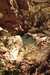 Looking down on a pool of water in the mountains