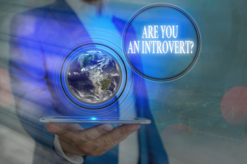 Handwriting text Are You An Introvertquestion. Conceptual photo an individual who tends to turn...