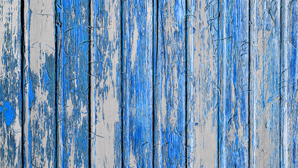 Fototapeta na wymiar Blue white painted exfoliated peeled wooden boards texture background
